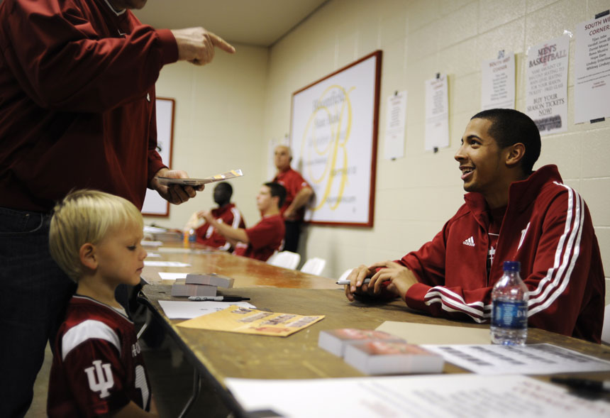 Indiana guard Verdell Jones III, right, listens to a fan after signing an autograph for Benjamin Miller, 3, of Moores Hill, Ind. during Hoosier Hysteria on Friday, Oct. 16, 2009, at Assembly Hall in Bloomington, Ind.