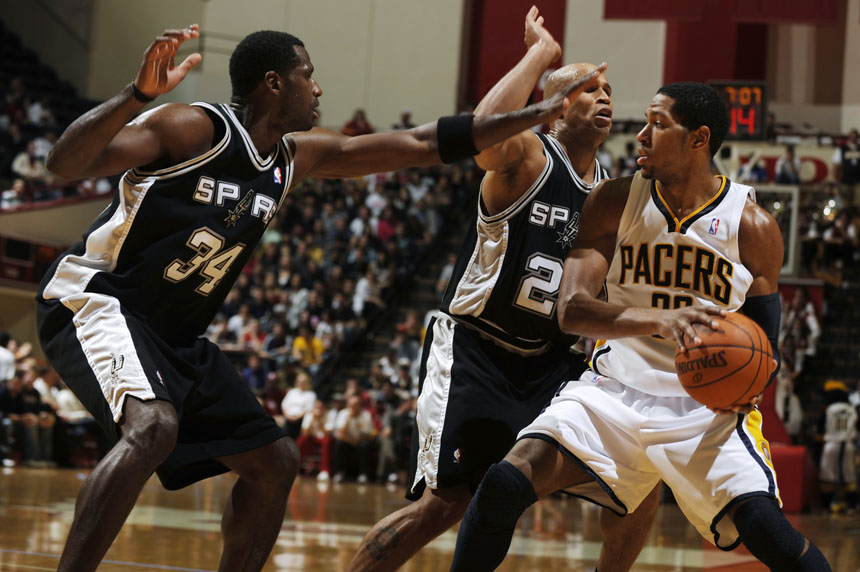 San Antonio Spurs center Antonio McDyess, left, and forward Richard Jefferson swarm Indiana Pacers forward Danny Granger during a preseason NBA game on Friday, Oct. 23, 2009, at Assembly Hall in Bloomington, Ind.