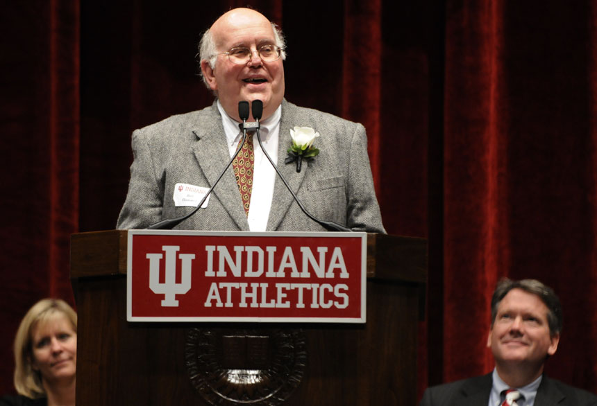 Former Bloomington Herald-Times sportswriter Bob Hammel gives an acceptance speech for former basketball coach Bob Knight during the Indiana University Athletics Hall of Fame induction ceremony on Friday, Nov. 6, 2009, at Assembly Hall in Bloomington, Ind. Hammel, a friend of Knight, co-authored a book with the former IU coach.