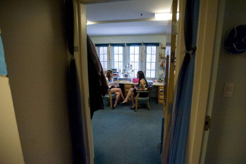 A Kappa Kappa Gamma member, left, speaks with a new potential member in one of the bedrooms during Eight Party on Saturday, Jan. 9, 2010, at the chapter's Third Street house.