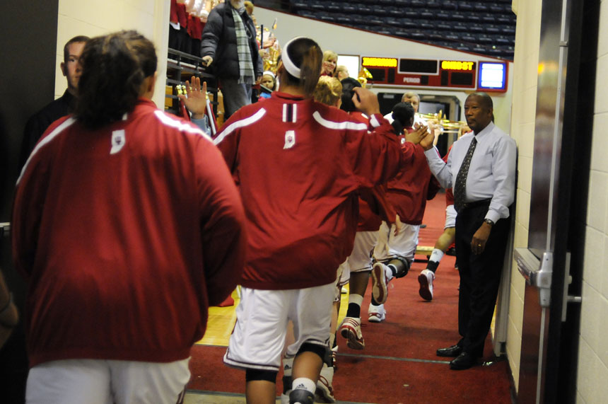 IU athletics trainer Robert Black high fives players as they make their way onto the court to warm up before a game against No. 4 Ohio State on Sunday, Jan. 31, 2010, at Assembly Hall.