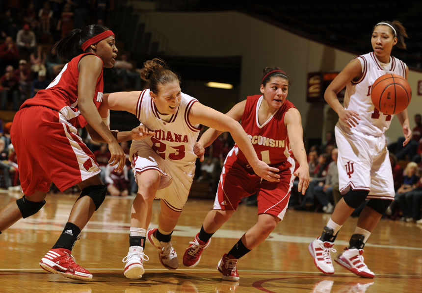 Indiana guard Jamie Braun (23) struggles  to grab the ball after it was knocked away by a Wisconsin defender during a game on Thursday, Jan. 28, 2010, at Assembly Hall.