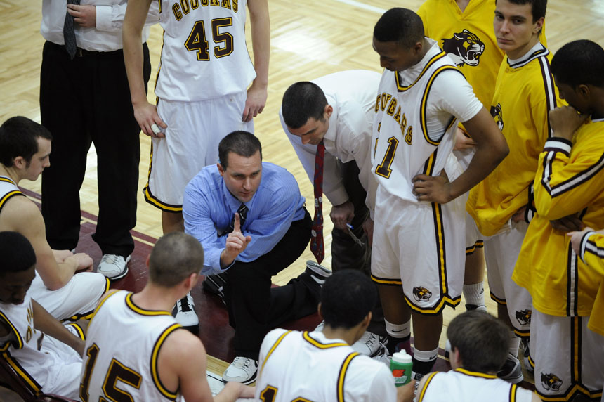 North coach Andrew Hodson speaks to his players during a timeout in a game on Friday, Jan. 29, 2010, at Bloomington North.