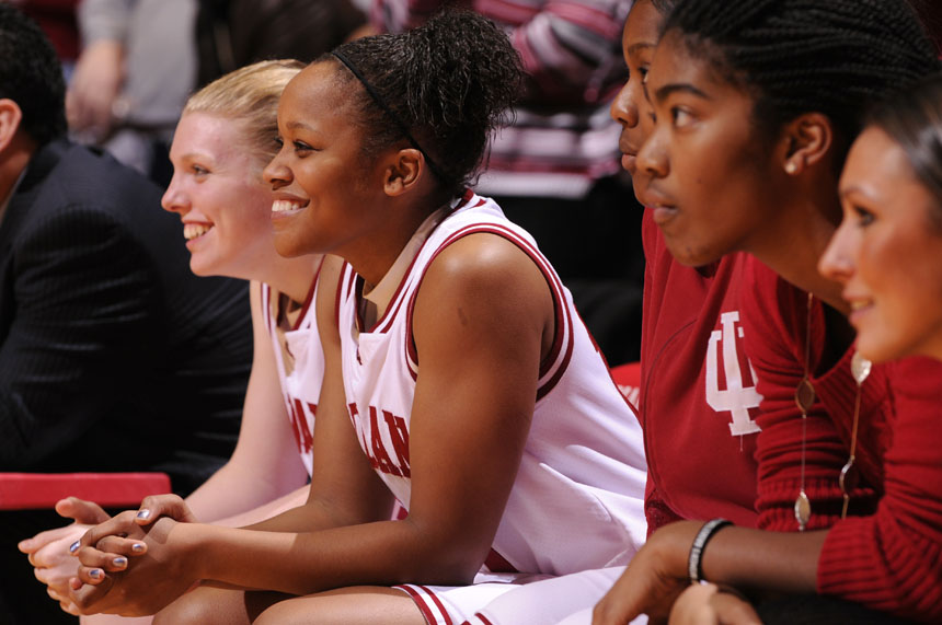 Indiana guard Andrea McGuirt, middle, and forward Aulani Sinclair smile late in a game against Ohio State when it became clear IU would upset the Buckeyes in a game on Sunday, Jan. 31, 2010, at Assembly Hall.