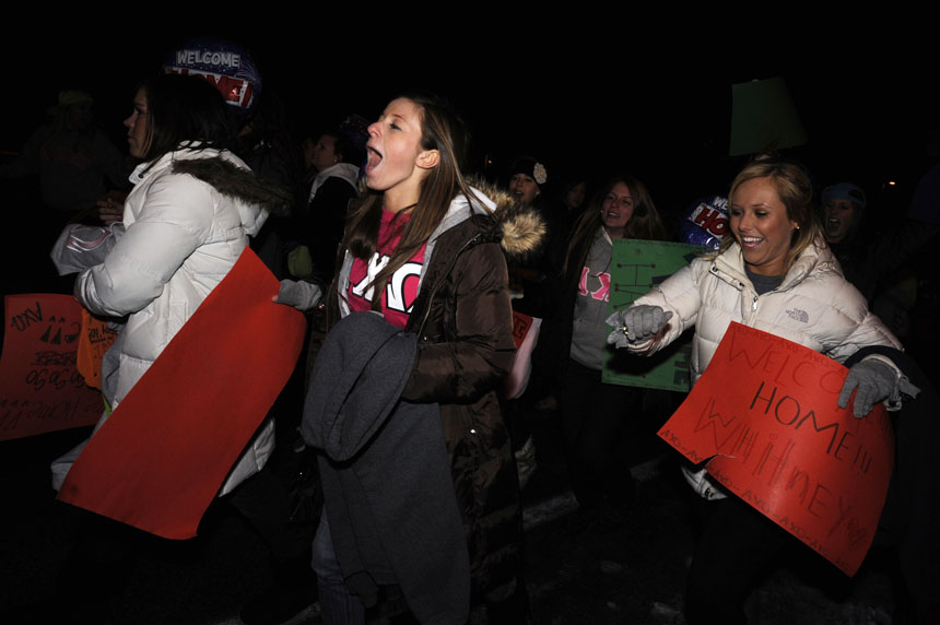 Alpha Chi Omega rush towards a bus carrying new members during Bid Day on Monday, Jan. 11, 2010, outside the chapter's Jordan Avenue house.
