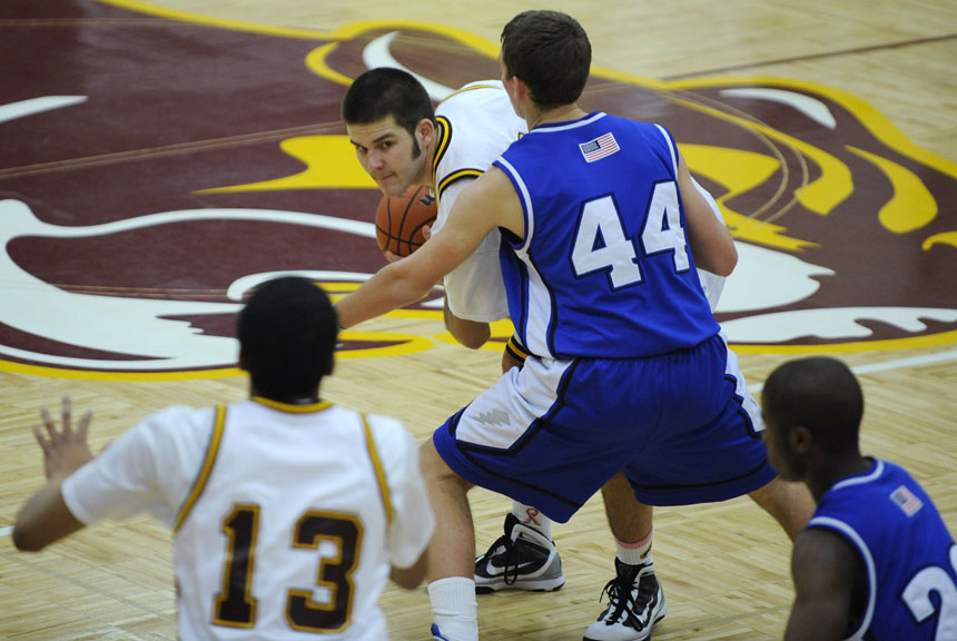 North's Hogan Stanger looks to pass to teammate Julian Boatner (13) during a game against Franklin Central on Friday, Jan. 29, 2010, at Bloomington North.