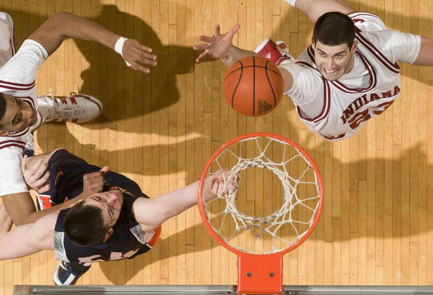IU forward Bobby Capobianco, right, reaches out to grab a rebound in front of Illinois center Mike Tisdale during the second half of IU's 66-60 loss to Illinois on Saturday, Jan. 9, 2010, at Assembly Hall.