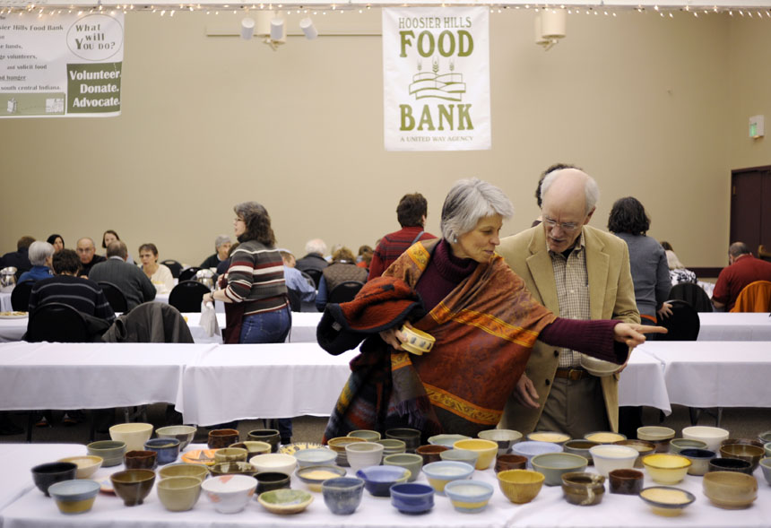 Anne Marie Thomson, left, points out a bowl to her husband, Dr. Jim Calli, during the 16th Annual Soup Bowl on Sunday, Feb. 21, 2010, at the Bloomington Convention Center. Patrons selected soup bowls made by local artists.