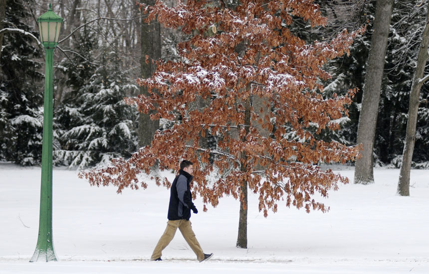A student makes his way down a sidewalk early on Saturday, Jan. 6, 2010, near the IU Jacobs School of Music. Inches of overnight snowfall and drifting winds made the IU campus a winter wonderland on early Saturday morning.
