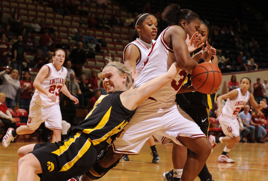 Iowa guard Jaime Printy, left, tries to strip a rebound away from Indiana guard Jori Davis during a game on Thursday, Feb. 11, 2010, at Assembly Hall. Iowa out rebounded IU 53-29 en route to a 71-67 win.