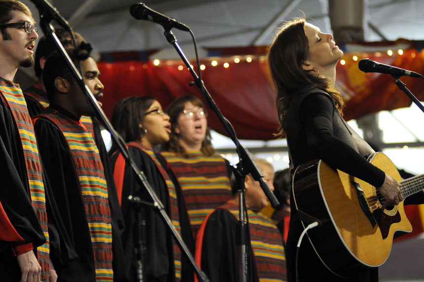 Carrie Newcomer, a local folk musician, performs the song "If Not Now" with the IU African American Chord Ensemble during a performance at the 16th Annual Soup Bowl on Sunday, Feb. 21, 2010, at the Bloomington Convention Center.