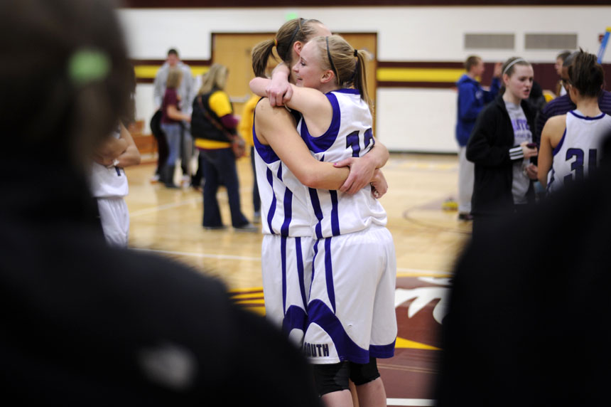 South's Kelsee Ennis, right, shares a hug with teammate Jessica Parker following a 45-32 win over North to claim the 4A sectional title on Tuesday, Feb. 16, 2010, at Bloomington North.