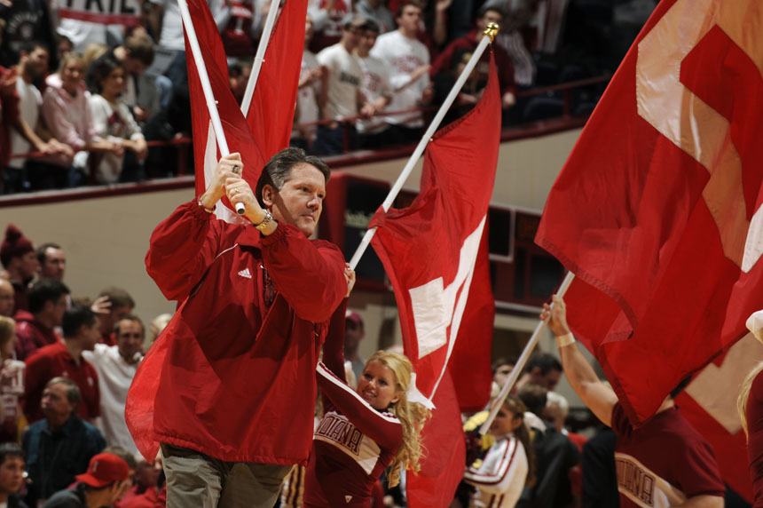 IU athletics director Fred Glass runs with an IU flag at midcourt with the cheerleaders during a game against Ohio State on Wednesday, Feb. 10, 2010, at Assembly Hall in Bloomington, Ind. (James Brosher / For The Star)