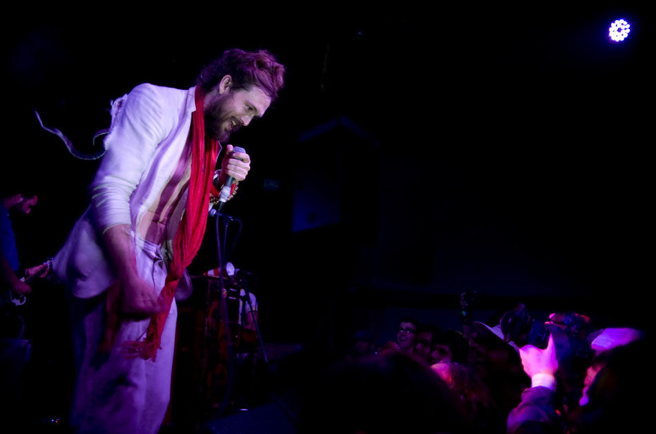 Alex Ebert, lead singer of Edward Sharpe and the Magnetic Zeros, talks with a member of the audience between songs during a performance with his band at La Zona Rosa on Tuesday, July 6, 2010. Tuesday night's show was a sell out.