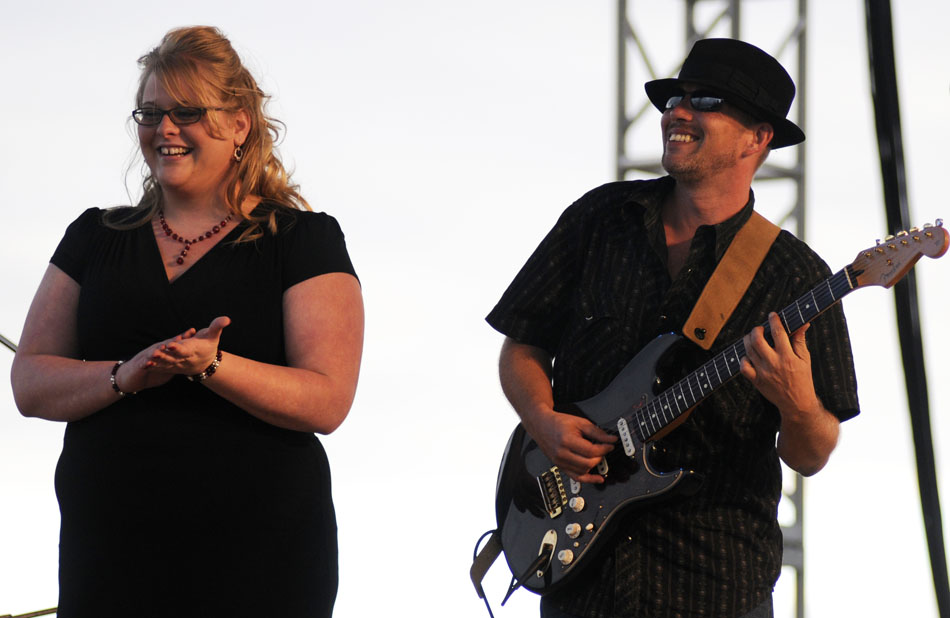 Big Silver Derailed members Mallory Coons, left, shares a laugh with guitarist Sean Ward mid-song during a performance on Friday, Sept. 3, 2010, at the Illinois Blues Festival on the Riverfront.