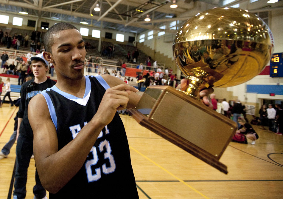 East's Ramon Robinson points to a place where the team's 64-43 win against Central will be recorded on a traveling trophy after a game on Saturday, Feb. 12, 2011, at Storey Gym in Cheyenne.