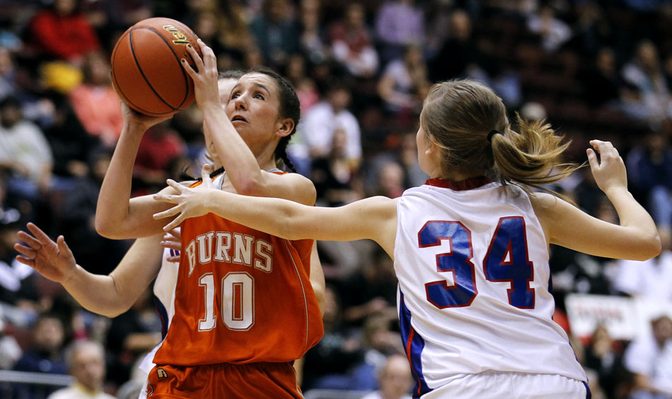 Burns' Alex Ward (10) puts up a shot as she's guarded by Lovell's Chelsey Ellis (34) during the Class 2A championship game on Saturday, March 5, 2011, in Casper, Wyo.