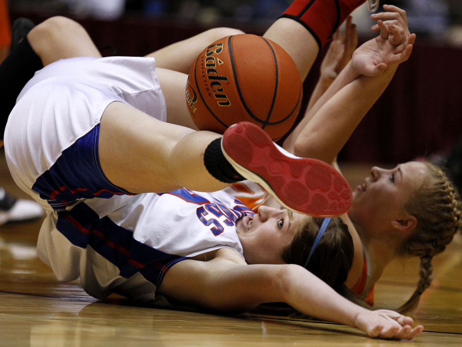 Lovell's Karen Koritnik watches as the ball bounces away from her as she falls to the floor with Burns' Becca Miller during the Class 2A championship game on Saturday, March 5, 2011, in Casper, Wyo.