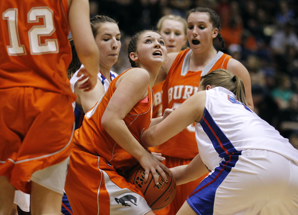 Burns' Bailey Ward, center, reacts as Lovell defenders attempt to strip the ball away from her during the Class 2A championship game on Saturday, March 5, 2011, in Casper, Wyo.