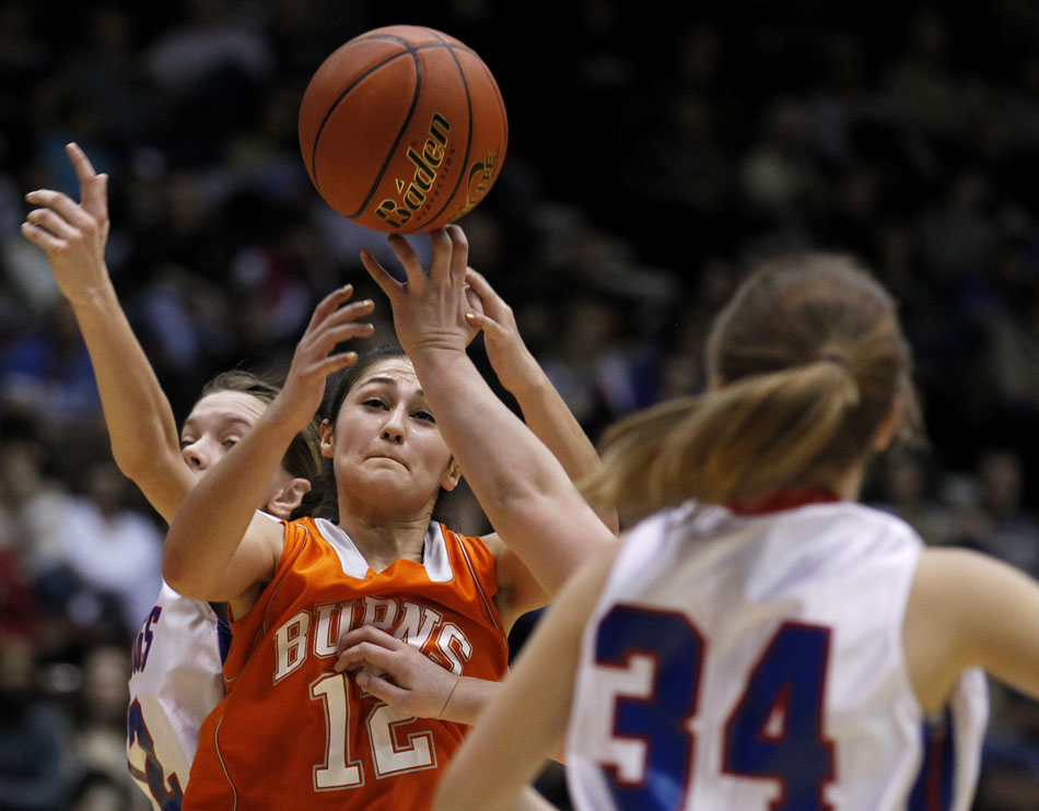 Burns' Ashley Spatz (12) looses the handle on the ball as a Lovell defender knocks it away during the Class 2A championship game on Saturday, March 5, 2011, in Casper, Wyo.