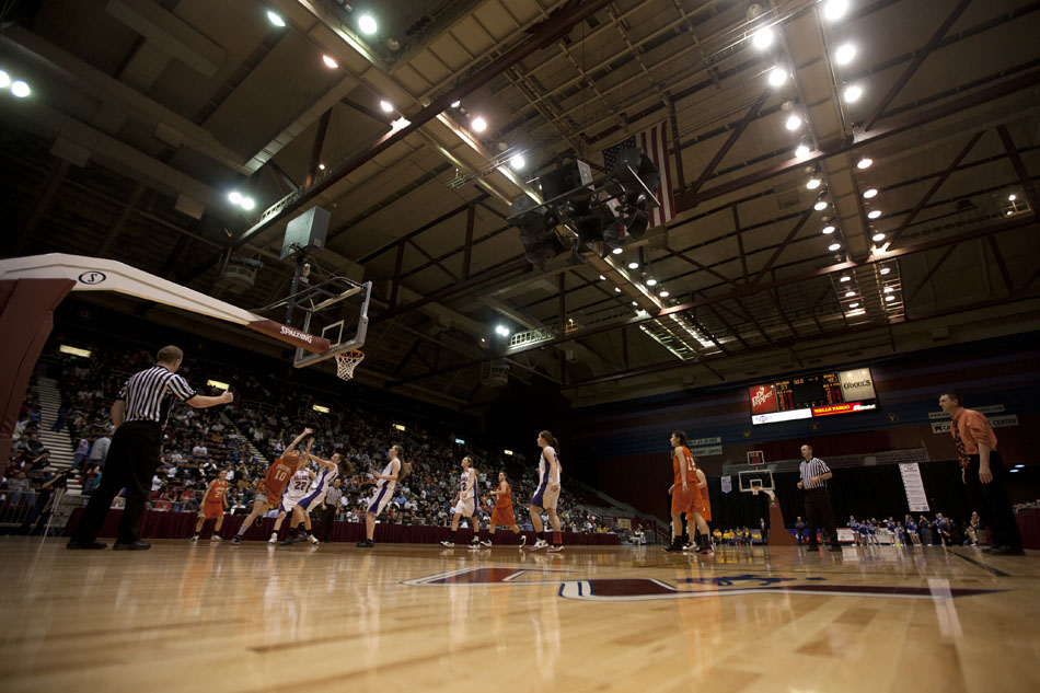 Burns (orange) takes on Lovell during the Class 2A championship game on Saturday, March 5, 2011, in Casper, Wyo.