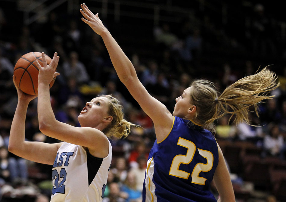 Cheyenne East's Meghan Sipe puts up a shot as Sheridan's Kayla Woodward looks for the block during a Class 4A girl's basketball semi-final on Friday, March 11, 2011, in Casper, Wyo.