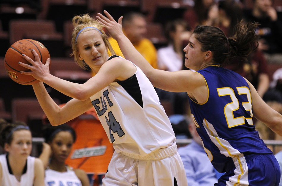 Cheyenne East's Anna Reiner (14) reacts as she draws contact from Sheridan's Steph Sessions during a Class 4A girl's basketball semi-final on Friday, March 11, 2011, in Casper, Wyo.