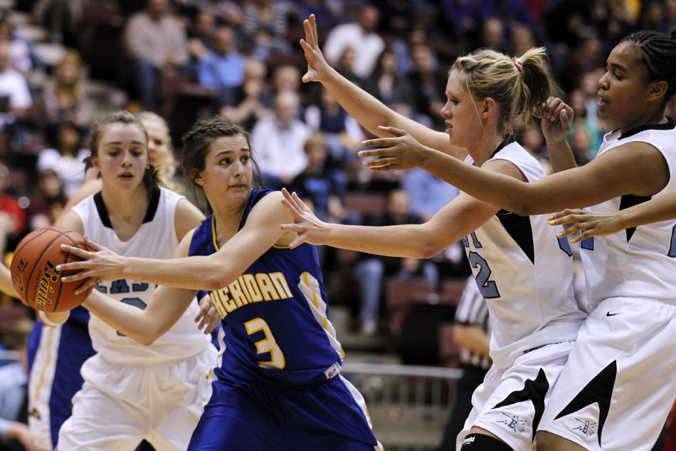 Sheridan's Noelle Gollinvaux (3) looks to pass as she's guarded by Cheyenne East's Savannah Minder, right, Meghan Sipe and Brittany Lawson during a Class 4A girl's basketball semi-final on Friday, March 11, 2011, in Casper, Wyo.