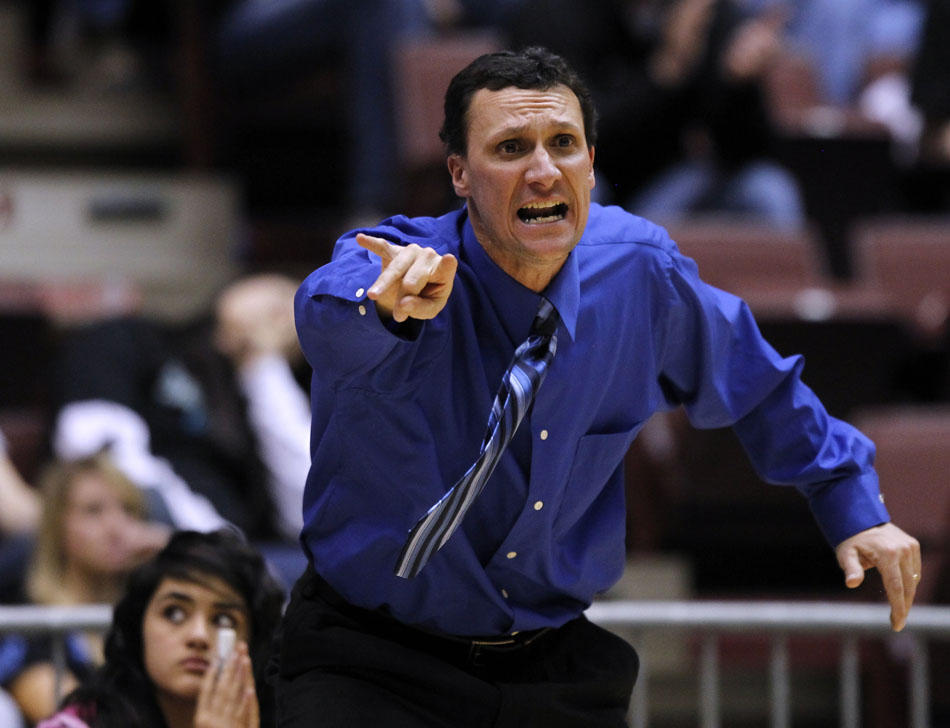 Cheyenne East coach Rusty Horsley yells instructions to his players during a Class 4A girl's basketball semi-final on Friday, March 11, 2011, in Casper, Wyo.