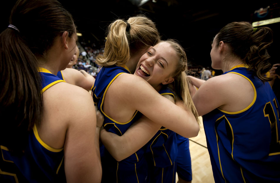 Wheatland's Muira Bunker, center, celebrates with her teammates after  a 47-41 win against Buffalo in the Class 3A girl's basketball state championship game on Saturday, March 12, 2011, in Casper, Wyo.