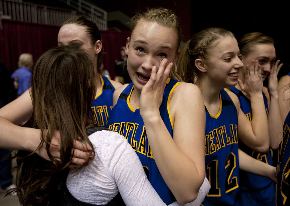 Wheatland's Natalie de Ryk wipes tears from her eyes as she celebrates with her teammates following a 47-41 win against Buffalo in  the Class 3A girl's basketball state championship game on Saturday, March 12, 2011, in Casper, Wyo.