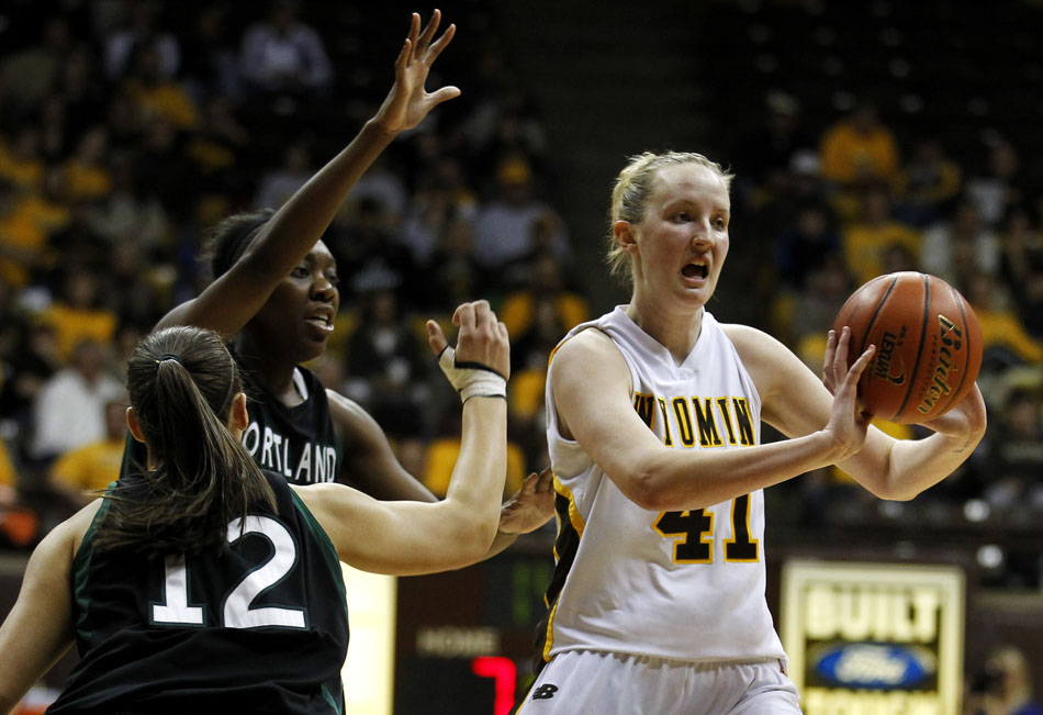 Wyoming forward Hillary Carlson (41) looks to make a pass during a WNIT game against Portland State on Wednesday, March 16, 2011, in Laramie, Wyo.