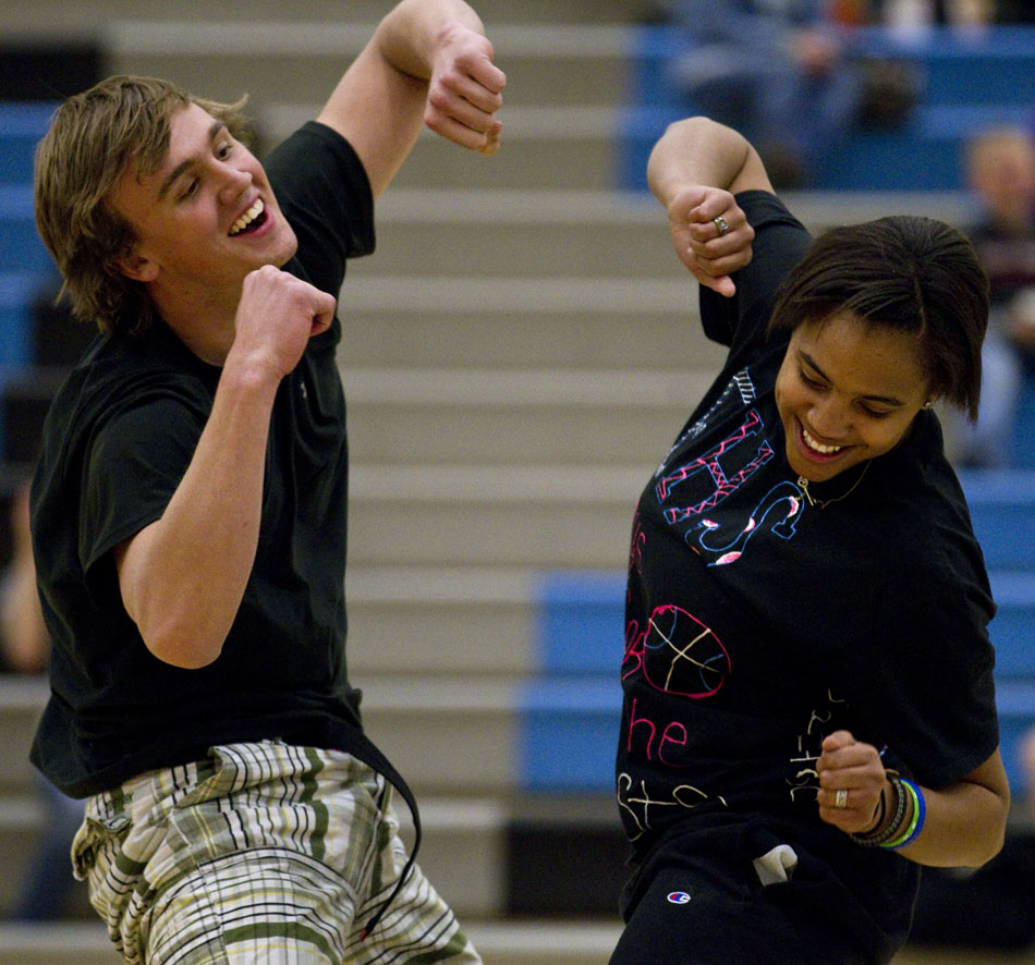 Cheyenne East students Jeremiah Hunter, left, and Brittany Lawson compete in a dance off during the halftime of a charity basketball game between East coaches and the school's varsity boy's basketball players on Wednesday, March 23, 2011, at the school. The friendly game benefited Isaac Salas, a Cheyenne South High School wrestler who broke his neck in November.
