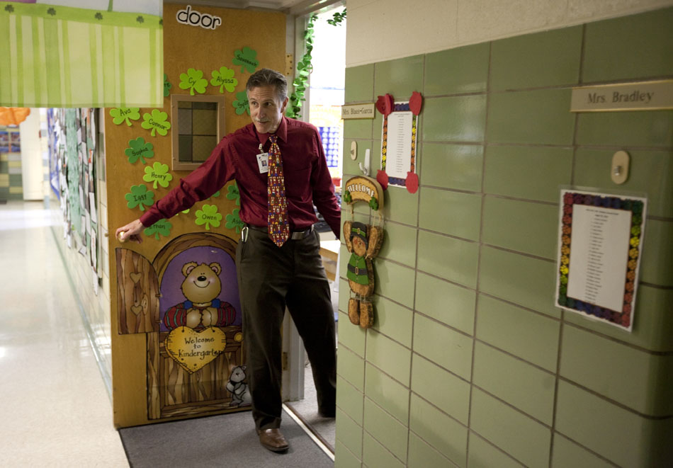 Mark Stock, superintendent of Laramie County School District No. 1, leans out of a classroom door to survey the hallway before leading a class of kindergarten students to recess on Thursday, March 24, 2011, at Jessup Elementary. Stock was at the school teaching in place of Kathleen Blaes-Garcia for the day. "It's been refreshing," said Stock, who taught third and sixth graders for eight years before becoming an administrator.