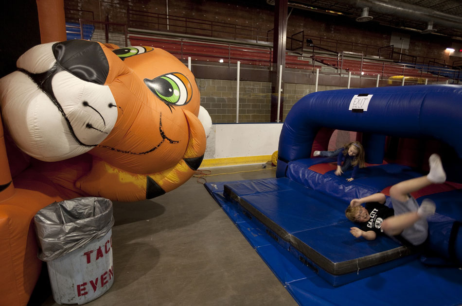 A few youngsters roll out of an inflatable obstacle course during the city-sponsored spring carnival on Wednesday, April 20, 2011, at the Cheyenne Ice and Events Center.