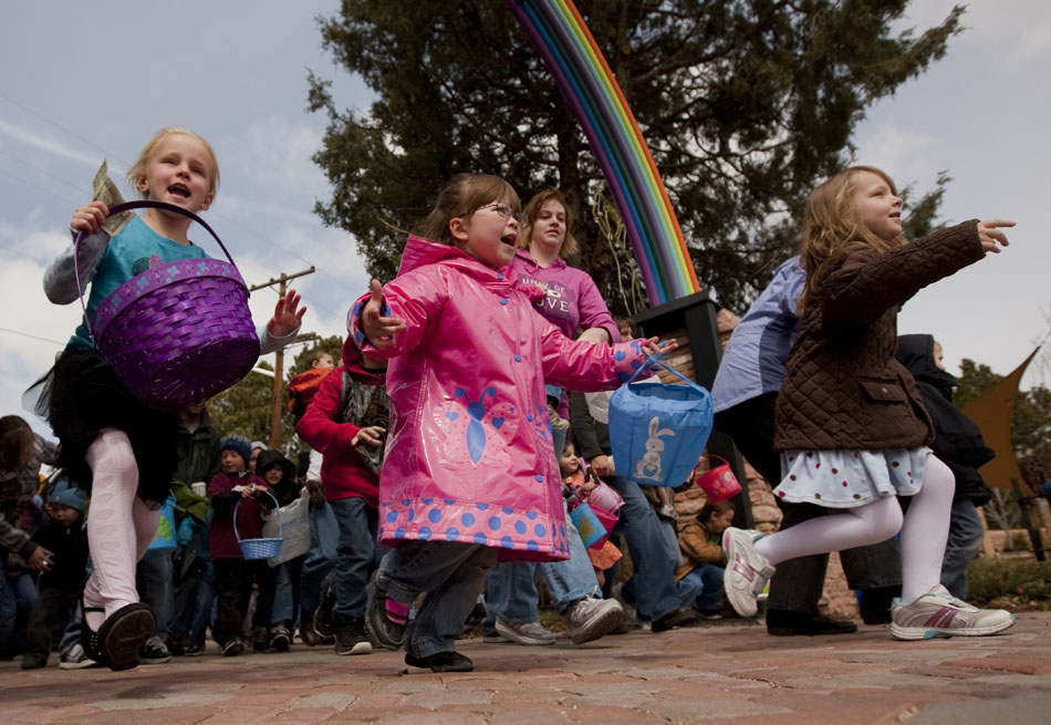 Youngsters react as they run  into the Children's Village at the Botanic Gardens for an Easter egg hunt on Saturday, April 23, 2011, in Lion's Park. Workers opened the gates at 11 a.m. to a stampede of children who cleared the park of Easter eggs within five minutes.