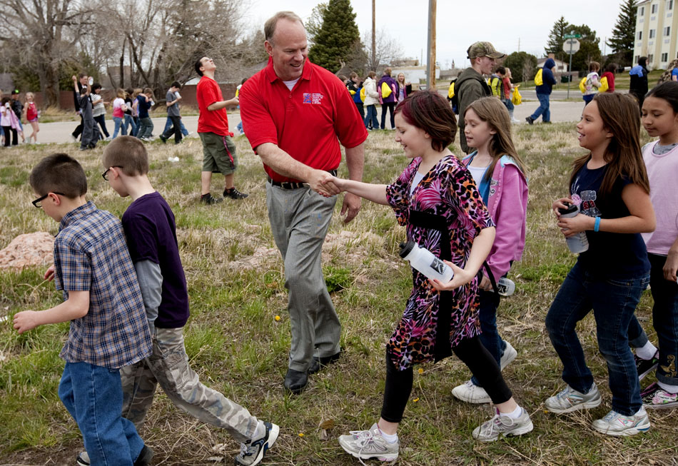 Wyoming Gov. Matt Mead shakes hands with a few youngsters during a walk on Tuesday, May 3, 2011, near the Cheyenne Ice and Events Center. The walk was part of the Govenor's Council on Physical Fitness, Health and Fitness Day.