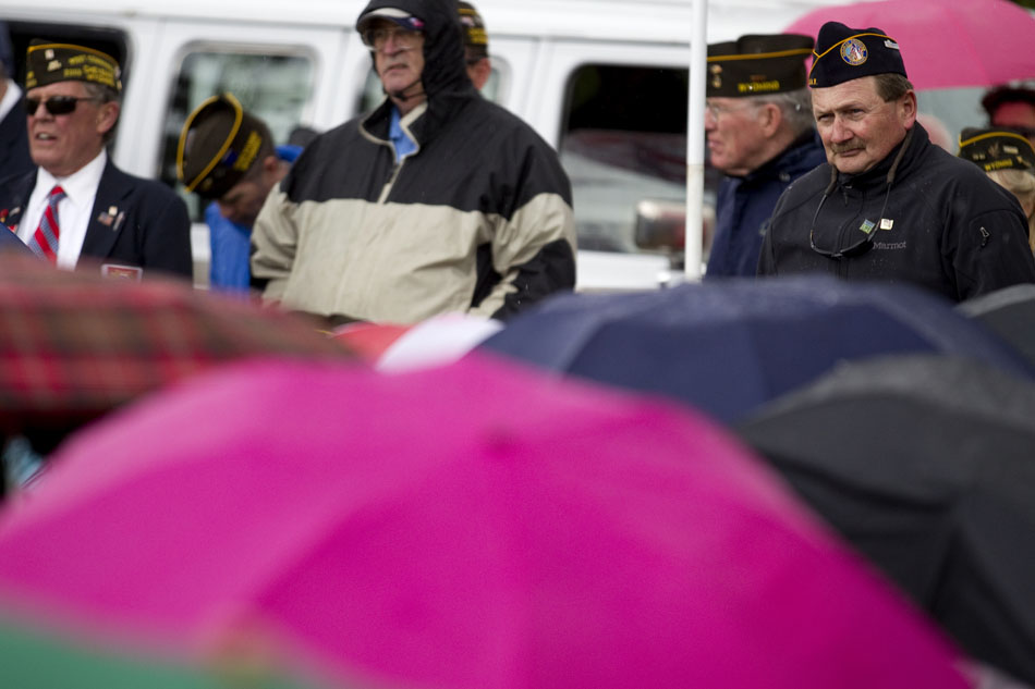 A group of veterans watch across umbrella tops during a Memorial Day ceremony on Monday, May 30, 2011, at Beth El Cemetery in Cheyenne.