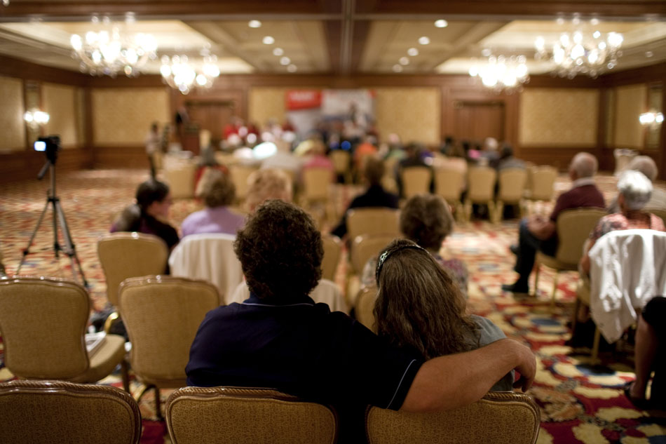 A couple watch the action from the back of the room during the AARP National Spelling Bee on Saturday, June 18, 2011, at the Little America in Cheyenne.