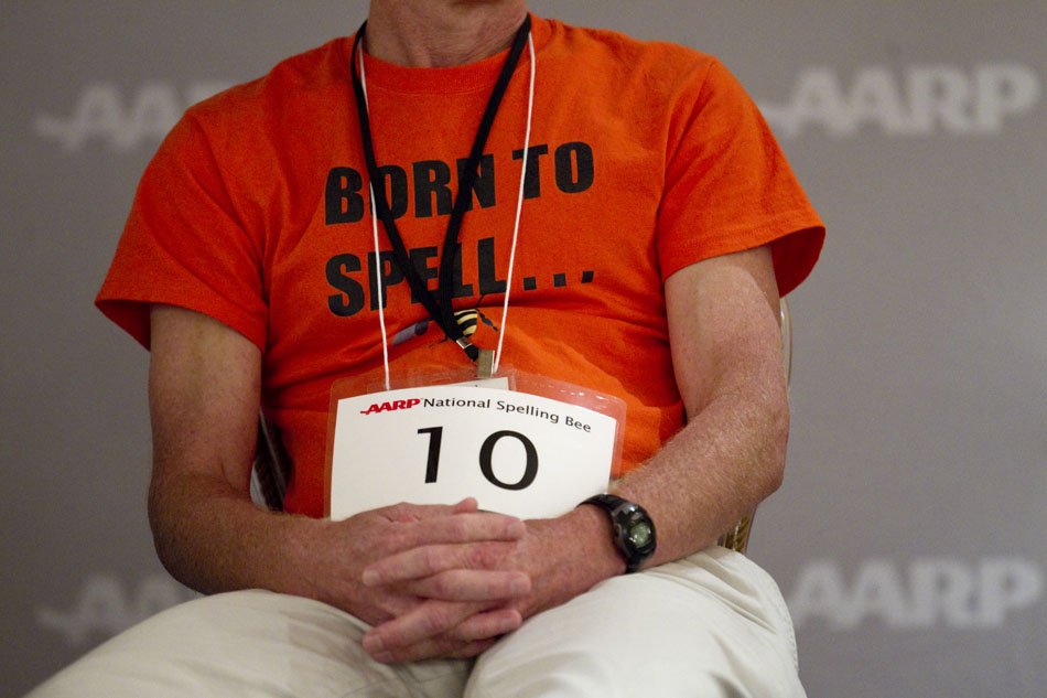 Scott Firebaugh, the 2010 AARP National Spelling Bee champion, wears a "born to spell" shirt that he wore during last year's spelling bee on Saturday, June 18, 2011, at the Little America in Cheyenne. Firebaugh finished third in this year's bee.