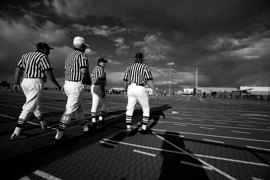 Officials make their way onto the field before a Class 4A football game between Cheyenne Central and Cheyenne South on Friday, Sept. 2, 2011, at Cheyenne South High School. Central won 63-0.