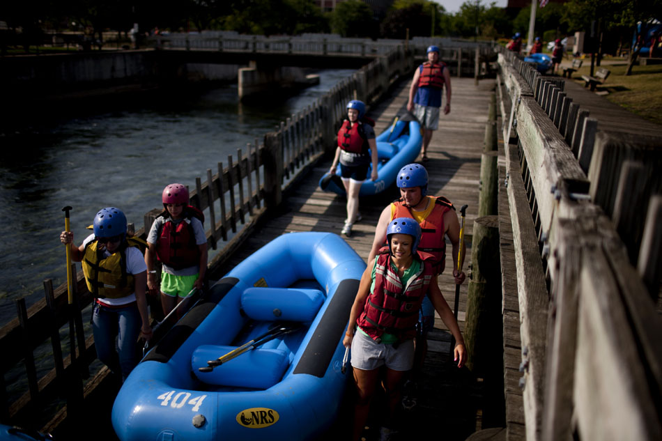 Teams of rafters from the Young Professionals Network prepare to take to the water on the East Race Waterway on Tuesday, July 17, 2012, in downtown South Bend. (James Brosher/South Bend Tribune)