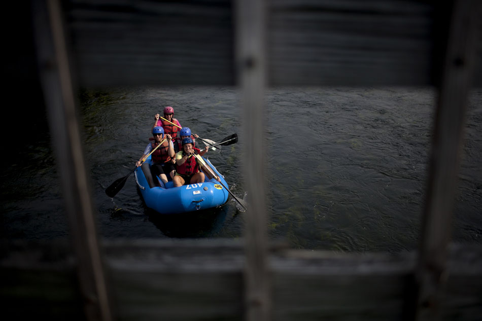 A team of rafters from the Young Professionals Network makes its way down the East Race Waterway on Tuesday, July 17, 2012, in downtown South Bend. The group, sponsored by the Chamber of Commerce for St. Joseph County, was marking its seventh anniversary. (James Brosher/South Bend Tribune)