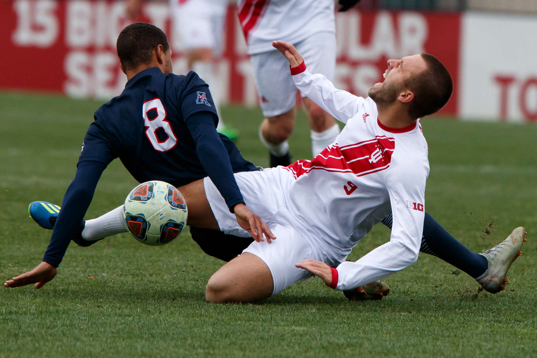 Connecticut's Felix Metzler (8) fouls Indiana's Thomas Warr (9) during the second half of an NCAA men's soccer tournament match at Bill Armstrong Stadium in Bloomington, Ind. on Sunday, Nov. 18, 2018. IU won 4-0. (James Brosher for The Herald-Times)
