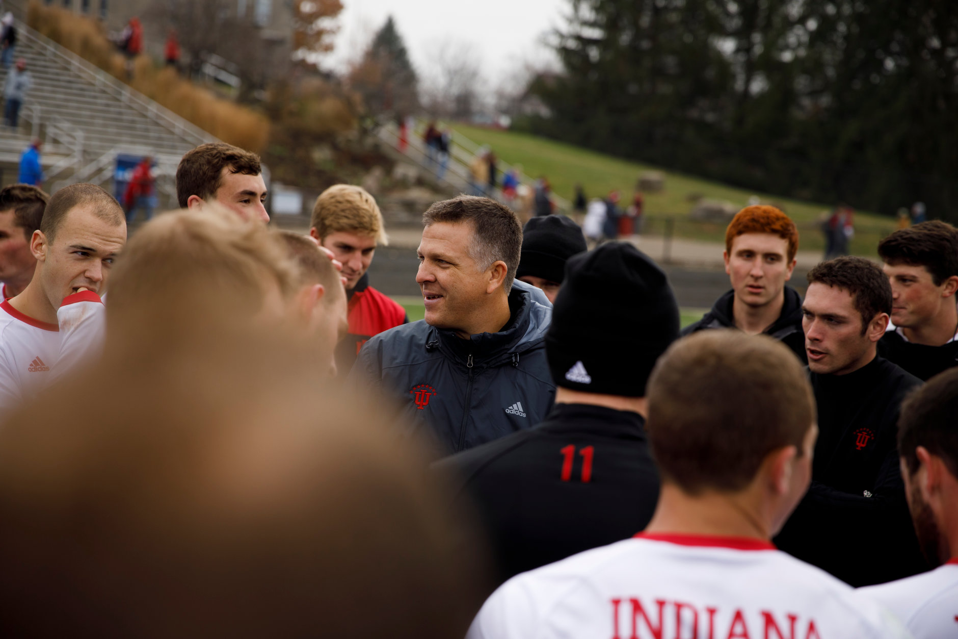 Indiana head coach Todd Yeagley speaks with his players following a 4-0 win against Connecticut in an NCAA men's soccer tournament match at Bill Armstrong Stadium in Bloomington, Ind. on Sunday, Nov. 18, 2018. (James Brosher for The Herald-Times)